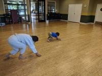 Mom (Huiming) and Son (Jay) polishing the dojo floor.  Who is going faster?