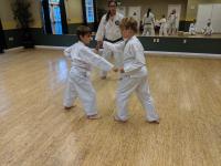 Owen and David face each other in kumite